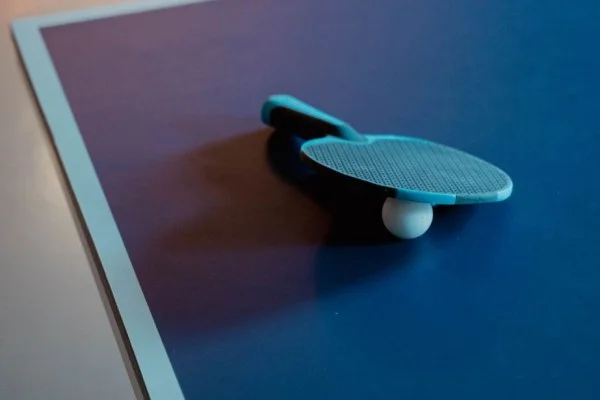 table tennis paddle and ball close up